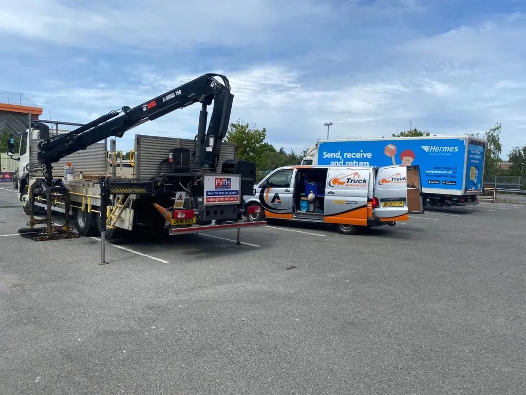 Truck-mounted cranes and branded Truck Cranes service vehicles