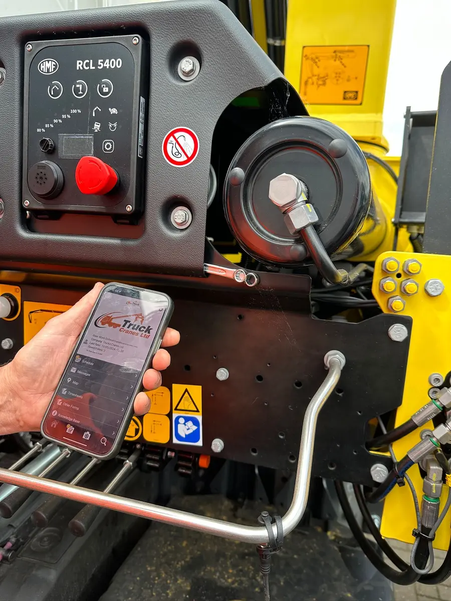 Phone scanning a QR label on operational equipment